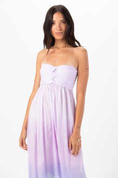 You are ready to take on the sunshine in our Jasmine Maxi Dress. This strapless wonder is a Tiare Hawaii staple, featuring a delicate strapless bodice and floor length flowing fabric. Take Jasmine with you wherever you go, from vacation to a sunny outdoor wedding, she is easily dressed up or down. Details: 100% Rayon Hand wash cold & Lay flat to dry Features: Unlined skirt, Lined bodice, Strapless bodice, Delicately folded fabric details, Elastic detail on back for adjustable fit, Self tie thick straps that can be tied around waist or around the neck for a halter style fit Measurements: 48.5"in length, 15" bodice width Summer Strapless Ruched Tube Top, Spring Strapless Sundress With Adjustable Straps, Strapless Sundress With Adjustable Straps For Spring, Beach Sundress With Fitted Bodice And Sweetheart Neckline, Beach Sundress With Sweetheart Neckline And Fitted Bodice, Spring Bandeau Strapless Bridesmaid Dress, Spring Bandeau Strapless Dress For Bridesmaids, Fitted Bodice Sundress With Sweetheart Neckline For Beach, Spring Strapless Bandeau Bridesmaid Dress