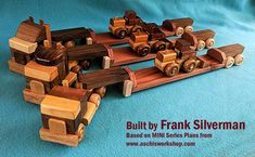 a wooden toy truck and trailer on a blue background with the words built by frank silverman