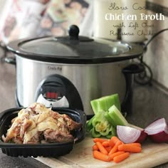 a slow cooker with meat and vegetables on the cutting board in front of it