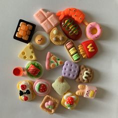 there are many different toy food on the table