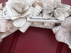 a close up of a wreath made out of book pages