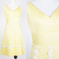 S T R A I G H T T A L K ▲ Circa: 1960s ▲ Tag: Henri Ravoux Creations ▲ Material: Cotton Poly Blend ▲ Condition: Very Good D E T A I L S ▲ Heavy waffle textured yellow cotton poly blend ▲ Spaghetti strap dress with crossover v-neckline ▲ Defined waist with white rick rack detail going down skirt of dress ▲ Knee-length a-line skirt ▲ Unlined ▲ Covered zipper in back Please note, the first few photos are slightly washed out, and the bright yellow of the dress is more in line with the last photos. C 1950s Style Summer Dress With Ruffles, 1950s Style Ruffled Summer Dress, Spring A-line Vintage-inspired Dress, Spring Mid-century A-line Dress, Mid-century A-line Spring Dresses, 1950s Style Spring Cocktail Dresses, Lined Mod Summer Dresses, 1950s Style Summer Cocktail Dress, 1950s Style Cocktail Dress For Spring