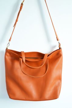 "Perfect Tote Bag Leather- ORANGE TOTE BAG, Full grain Leather Tote Express delivery by UPS for ONLY 15$ MORE! Please add your phone number for courier, in comment to order. 3-4 business days to US and Canada, 1-2 days in EU, 3-5 days worldwide. Regular shipping: 7-10 business days to US and Canada, 3-5 days in EU, 10-15 days worldwide. Simple and roomy tote bag made from high quality pebbled leather. This large tote bag is suitable for carrying everything in your everyday life. Spacious interio Everyday Orange Tote Shoulder Bag, Orange Leather Tote Bag, Orange Large Capacity Tote Shoulder Bag, Orange Soft Leather Bag With Double Handle, Yellow Soft Leather Tote Bag, Orange Tote Bags, Macbook Bag, Oxblood Leather, London Bags