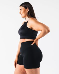 HIGHLIGHTS. Strappy Racer back Breathable mesh Layering FIT SUGGESTION. This item runs true to Alphalete's tight fit... Laura is 5’6”/168cm, wearing a size XS. with 28"/71cm bust. MATERIALS AND WASHING DIRECTIONS. 65% Nylon, 35% Spandex. We recommend washing inside-out on a cold setting. Hang to dry DESCRIPTION This light weight mesh makes for the perfect summer layering piece. Wear it over any of your favorite Alphalete bras for a stylish layer that will help keep you cool in the summer heat. | Compression Activewear With Built-in Bra And Short Length, Workout Activewear With Built-in Bra, Short Length, Fitted Mesh Activewear With Bra Friendly Design, Versatile Sports Bra With Mesh Back, Stretch Mesh Activewear With Built-in Bra, Fitted Racerback Activewear With Built-in Shorts, Fitted Mesh Back Versatile Activewear, Black Compression Mesh Sports Bra, Black Stretch Mesh Sports Bra