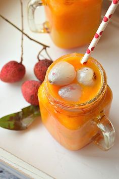 two glasses filled with orange juice and ice