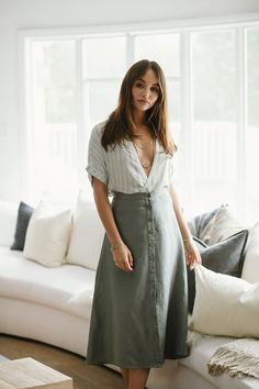 Meet the prettiest button down midi around. It'll make you want to go on picnics and frolic around a field of daisies. Am I right? Lightweight linen Style with a cropped tank Sage green Linen Button Down A Line Midi Skirt Model is 5'10" and wearing a size medium Fabric Content: Woven 55% Linen 45% Viscose Button Skirt Outfit, Linen Skirt Outfit, Linen Skirt Midi, Green Skirt Outfits, Denim Midi Skirt Outfit, Bicycle Aesthetic, A Line Skirt Outfits, Medium Sized Women, Jewellery Shoot