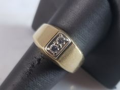 A MENS VINTAGE ESTATE 14K YELLOW GOLD BAND RING WITH .20cts OF DIAMONDS.  THE RING WEIGHS 9.8g. THE SIZE OF THE RING IS A 10.0.   RING IS MARKED ON THE INSIDE OF THE BAND.  THIS MAKES A LOVELY GIFT FOR THAT SOMEONE SPECIAL.  ANY QUESTIONS, PLEASE DO NOT HESITATE TO ASK. BE SURE TO CHECK OUT SOME OF MY OTHER GREAT ITEMS UP FOR SALE.  THANK YOU. Vintage Yellow Gold Rings With Diamond Accents, Diamond Signet Ring With 17 Jewels For Anniversary, Classic Yellow Gold Collectible Rings, Antique Yellow Gold Signet Ring With Brilliant Cut, Antique Yellow Gold Brilliant Cut Signet Ring, Collectible Yellow Gold Rings With Diamond Accents, Collectible Gold Rings With Diamond Accents, Vintage Gold Diamond Ring With Vvs Clarity, Antique Gold Diamond Ring With Vvs Clarity