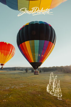 three hot air balloons flying in the sky