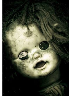 a creepy doll with big eyes and the words cuad final on it's forehead