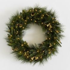 a christmas wreath with lights and bells