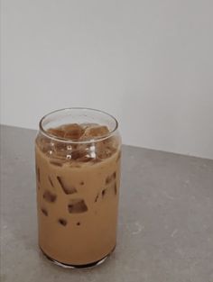 an iced drink in a glass on a table