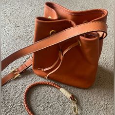 Handmade High Quality Leather Bag From Medellin Columbia. Never Used. Bnwt And Duster Bag. $560.000 Columbian Pesos = $141 Us Dollars Orange Bucket Bag For Travel, Luxury Orange Bucket Bag, Orange Leather Bucket Bag For Travel, Cognac Bucket Bag With Dust Bag For Travel, Orange Bucket Bag With Removable Pouch, Orange Bucket Bag For Daily Use, Orange Leather Bucket Bag For Shopping, Orange Leather Bucket Bag For Everyday Use, Orange Bucket Bag With Adjustable Strap