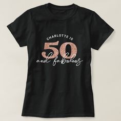 a black t - shirt that says charlotte is 50 and fabulous with pink glitter on the front