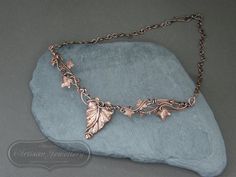 Antique copper leaf necklace Vines and leaves twist and twine to create this nature inspired antique copper necklace. Your neck piece will be made to order in the style shown. Due to the nature of the design no two pieces could ever be the same which makes each piece truly unique to you and also allows you to add a variation if you wish to do so. The focal piece will measure approximately 5 - 6 inches across and the chain length can be chosen by you. Please select your length from the drop down box. You can measure yourself with a flexible tape measure. Start at the centre of one collar bone, wrap the tape measure around your neck, finishing at the centre of your other collar bone.  If you would like advice on the length you will require, please ask.  **When choosing your chain length, ple Nature-inspired Rose Gold Necklace, Handmade Bronze Leaf Jewelry, Handmade Rose Gold Nature-inspired Necklaces, Hand Forged Copper Necklace In Rose Gold, Hand Forged Rose Gold Copper Necklace, Unique Copper Leaf Jewelry, Soldered Copper Rose Gold Necklace, Rose Gold Soldered Copper Necklaces, Rose Gold Soldered Copper Necklace