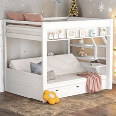 there is a white bunk bed with drawers underneath it and a yellow toy on the floor