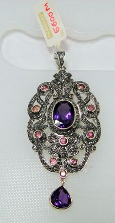 ITEM-VICTORIAN DIAMOND Amethyst Rubelite, 14 CT GOLD & STERLING SILVER PENDANT. SIZE-8/3.5 CM, TOTAL WEIGHT-15 GRAMS, Amethyst WEIGHT-17.5 CT, Rubelite Weight-4 ct, OLD CUT FLAT ROUND DIAMOND WEIGHT-6.80 CT, 14 CT GOLD WEIGHT-4.400 GMS ALL STONES ARE NATURAL AND OF HIGH QUALITY. MATERIAL-14 CT SOLID GOLD, SILVER, DIAMOND, Amethyst, Rubelite Gemstones. Silver Gemstones With Jewels In Fine Jewelry Style, Elegant Silver Gemstones With Jewels, Luxury Multi-stone Purple Jewelry, Luxury Purple Multi-stone Jewelry, Formal Multi-stone Amethyst Necklaces, Formal Multi-stone Amethyst Necklace, Formal Amethyst Multi-stone Necklace, Luxury Sterling Silver Necklace With Stone Setting, Luxury Silver Necklace With Stone Setting