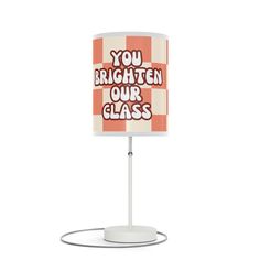 an orange and white lamp with the words you brighten our class on it