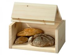 a wooden box filled with bread and loaves