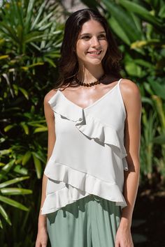 Elevate your wardrobe with the Cream Asymmetrical Ruffle V-Neck Cami. Its modern asymmetrical design and delicate ruffles will add a touch of elegance to any outfit. Product code: CAA04A4B036CC Features:  Woven V-neckline Sleeveless Asymmetrical ruffles Wash Method: Regular Wash Material: 100%POLYESTER. Summer Tops With Ruffles And Asymmetrical Neckline, Elegant Tops With Ruffles And Asymmetrical Neckline, Elegant Asymmetrical Top With Ruffles, Elegant Asymmetrical Ruffled Tops, White Asymmetrical Top With Ruffles, Beachwear Dresses, Affordable Swimwear, Make Memories, Asymmetrical Design