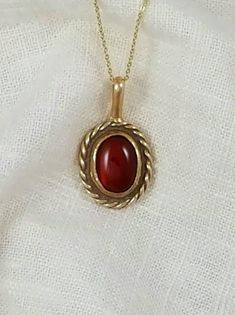 Hand-Crafted Ancient Bronze Pendant with a genuine 10x12 mm Carnelian stone.    Other stone options are available Approx Dimensions:  Length:  1 inch Width: 3/4 inch Total Length with loop: 1 1/4 inches Designed and Handcrafted by Randy from start to finish. Comes with a black adjustable cotton cord. Stones are natural and may vary in color.  Our pieces are made of solid jewelry grade ancient bronze and are not coated with any type of sealant that can chip off.   To keep your piece looking bright and shinny simply use a jewelry polishing cloth. Oval Amber Birthstone Jewelry, Antique Oval Cabochon Gemstone Necklaces, Classic Carnelian Yellow Gold Jewelry, Vintage Gemstone Necklace With Oval Cabochon, Classic Yellow Gold Carnelian Jewelry, Vintage Carnelian Jewelry With Polished Finish, Vintage Oval Large Stone Necklaces, Antique Oval Jewelry With Natural Stones, Oval Large Stone Vintage Necklace