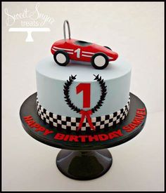 a birthday cake with a racing car on top