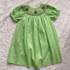 Rosalina Smocked Dress Watermelon Embroidery Lime Green 2t Nwot Playful Smocked Short Sleeve Summer Dress, Playful Smocked Dress With Short Sleeves For Summer, Playful Short Sleeve Smocked Summer Dress, Green Cotton Smocked Short Sleeve Dress, Green Cotton Smocked Dress With Short Sleeves, Summer Smocked Short Sleeve Dress For Playtime, Cute Green Smocked Dress, Playful Summer Smocked Dress With Smocked Cuffs, Childhood Clothes