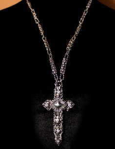 This is a stunning SG Liquid Metal unisex microchip skeleton cross by Sergio Gutierrez embellished with handmade roots and SG signature brush silver soldering technique. One of a kind Necklace. The cross comes on a delicate famous handcrafted “CH1” Chain link made completely of ball chain and enhanced with brilliant cut zircons. Sergio Gutierrez was granted a patent # US 6,536,112B1 as the inventor of the process for making jewelry incorporating a microchip. Allow 3 working days for the orders t White Gold Cross Necklace With Large Pendant, Luxury Silver Cross Jewelry, Unique Silver Cross Pendant Necklace, Unique Silver Necklace With Cross Pendant, Unique Silver Jewelry With Sparkling Details, Unique Adjustable Cross Jewelry, Adjustable Unique Cross Jewelry, Silver Metal Crucifix Jewelry, Silver Cross Pendant For Jewelry Making