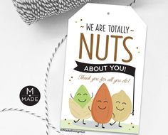 a card with two nuts on it next to some twine