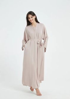 Serena Abaya Set - Light Nude Spring Workwear Abaya, Spring Long Abaya, Elegant Workwear Abaya In Maxi Length, Elegant Belted Abaya, Elegant Maxi Dress With Tie Waist And Kimono Sleeves, Elegant Dresses With Tie Waist For Loungewear, Elegant Solid Color Maxi Length Kaftan, Elegant Spring Abaya For Workwear, Elegant Spring Workwear Abaya