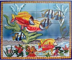 a colorful tile mural with fish and plants