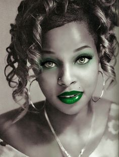 a black and white photo of a woman with green lipstick