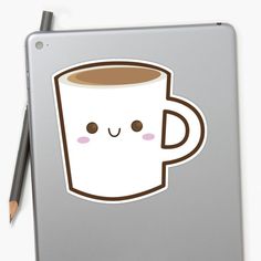 a laptop with a sticker of a coffee cup on the cover and a pencil next to it