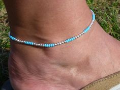 One of my best selling bracelets is the sterling silver & turquoise beaded one, so I thought I'd best make an ankle bracelet version and it's proven to be more popular than the bracelet! This ankle bracelet measures 10 inches in length (based on the average ankle size of 9 inches).  If you would like a larger ankle bracelet please say YES to an extenstion chain (additional £1) when ordering (the extension chain is a 2 inch silver plated chain). If you would like a smaller ankle bracelet please let me know on ordering and I will custom make you one. Materials used:     3mm Sterling Silver Beads     Turquoise Preciosa Beads     Silver Lobster Clasp     Clear Beading Cord     Optional Silver Plated 2 inch Extension Chain **If you'd like more than the available quantity showing please do get i Selling Bracelets, Turquoise Anklet, Beach Jewellery, Surf Jewelry, Beaded Anklet, Tarnished Jewelry, Sterling Silver Anklet, Beaded Anklets, Beach Living