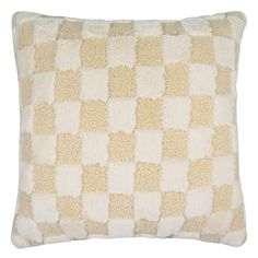 a beige and white checkered pillow on a white background