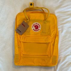 Fjallraven Kanken Backpack. New With Tags. Bright Yellow. Yellow Backpack For Outdoor Activities And Back To School, Back To School Yellow Backpack For Outdoor Activities, Yellow Backpack For Outdoor Activities, Yellow Bags For Back To School, Yellow Standard Backpack For Outdoor Activities, Functional Yellow Backpack For Everyday, Casual Yellow Backpack For Daily Use, Functional Yellow Travel Backpack, Casual Yellow Backpack