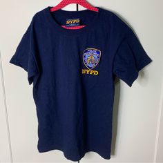 Nwot Nypd New York Police Department Embroidered Patch T-Shirt. Purchased At The Nypd Police Museum. Size Medium. U Blue Graphic Tee With Embroidered Logo, Blue Crew Neck T-shirt With Embroidered Graphics, Blue Crew Neck T-shirt With Embroidered Text, Blue Embroidered Crew Neck T-shirt, Blue T-shirt With Embroidered Graphics, Blue Graphic Tee With Embroidered Graphics, Blue Short Sleeve T-shirt With Embroidered Graphics, Blue Embroidered Graphics T-shirt, Blue Embroidered Graphics Short Sleeve T-shirt