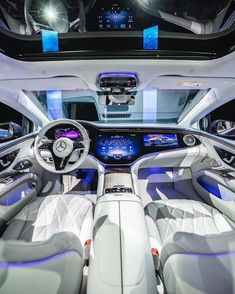 the interior of a modern car with blue lights