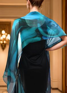 "Lovely blue ripples flow across delicate silk chiffon. Unique fractal design, digitally printed on the finest silk. Perfect shawl width, approx. 70\" x 17\", machine hemmed. Bright blue, teal and violet on see-through, airy chiffon. An eye-catching accent piece that looks good on light and dark colors. Unique scarf/shawl. Features: * Digitally printed original design * 100% silk chiffon. * Approx. 70\" x 17\" * Machine hemmed * Dry clean only * Ironing OK, but use a press cloth to prevent stain Elegant Blue Shawl Scarves, Elegant Blue Silk Shawl Scarf, Elegant Blue Silk Shawl, Elegant Blue Scarves For Party, Elegant Blue Silk Scarf For Evening, Elegant Blue Shawl, Small Silk Scarf, Green Silk Scarf, Unique Scarf