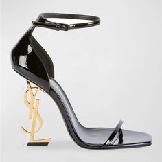 These Eye-Catching Ankle-Strap Sandals Feature A Unique Interlocking Ysl Logo Heel, Making A Bold Statement With Every Step. Condition: Never Worn Brand: Saint Laurent Size: 39 Material: Shiny Patent Leather Heel: 4.3" Golden Ysl Heel Design: Elongated Square Open Toe Style: D'orsay Silhouette Strap: Adjustable Ankle Strap Interior: Leather Lining Sole: Leather Outsole Extras: Includes Dust Bags Ysl Sandals, Dr Shoes, Ysl Heels, Yves Saint Laurent Shoes, Ysl Shoes, Ankle Strap Pumps, Patent Leather Heels, Carrie Bradshaw, Footwear Design Women