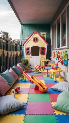 a colorful play area with lots of pillows and toys