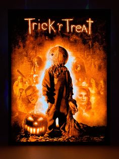 a movie poster for trick'n treat with a creepy scarecrow standing in front of pumpkins