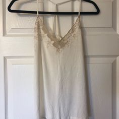 Aeo Soft&Sexy Tank With Floral Crochet Detailing At Top. Loose Fitting And In Perfect Condition. Nwot, Never Worn White Camisole Tank Top For Night Out, White Camisole With Built-in Bra For Night Out, White Spaghetti Strap Tank Top For Night Out, Chic White Backless Camisole, White Lace Top Camisole, White Cami Tank Top For Night Out, White Stretch Camisole For Night Out, Summer Backless Camisole With Lace Trim, White Stretch Lace Top Camisole