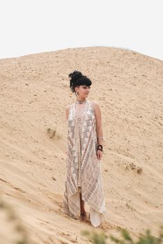 Elevate your festival style with our Exquisite Nomadic Backless Dress. This handcrafted tribal attire is perfect for ceremonies, festivals, and beach adventures. The ethereal blockprinted design adds a touch of bohemian charm, while the adjustable halter neckline allows for a customizable fit. Made from lightweight and breathable fabric, this dress is perfect for warmer weather and will keep you feeling comfortable and stylish all day long. It is the perfect dress to wear to beach ceremonies or to dance the night away at your favorite music festival. Versatility is key with this dress. Pair it with your favorite accessories for a statement-making look, or style it with bold statement jewelry for a tribal-inspired ensemble. For a more casual daytime look, layer it with a cozy cardigan. The Bohemian Harem Dress For The Beach, Bohemian Maxi Dress For Festivals, Hippie Festival Dresses For Coachella, Bohemian Maxi Dress For Beach Festival, Bohemian Maxi Dress For Festival Vacation, Free-spirited Boho Dress For Festival, Free-spirited Boho Print Dress For Festivals, Bohemian Beach Cover-up Dresses For Festivals, Bohemian Maxi Dress With Boho Print For Festival