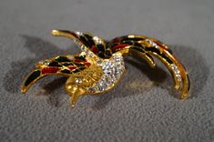 I am offering this fabulous vintage yellow gold tone pin. This piece is truly gorgeous, and it has the following features: * beautiful vintage brooch * bird design * enameled * rhinestone * multi colored * 2.5 inches in length This is a fantastic and classic piece. There is tons of sparkle and shine with this piece. It will beautifully complement your upcoming fashion season. Buyer pays all shipping and handling.01/11/16 Gold Enamel Costume Jewelry Brooches, Art Deco Yellow, Brooch Jewelry, Vintage Brooch, Fashion Seasons, Bird Design, Sparkle And Shine, Vintage Yellow, Pin Brooch