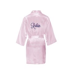 This satin girls robe comes embroidered with the name of your choice across the back. Perfect for the wedding day or girls sleepover. It will make the tiniest member of your bridal party feel like one of the big girls! Available in white or pink and embroidered with name on the back in the color of your choice. Perfect keepsake for your flower girl to remember the day by. Sizes XS, S, M, L fit ages 2-11 yrs. 100% polyester satin. Satin Charmeuse Blend Embroidered with Name on the Back Fits Ages Girl Sleepover, Girls Robes, Flower Girl Gifts, Polyester Satin, Girl Gifts, Bridal Party, Flower Girl, Satin, Wedding Day