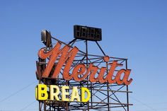 an old sign for a bread shop on top of a building