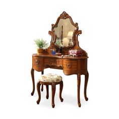 an antique dressing table with mirror and stool