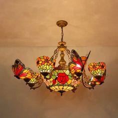 a stained glass chandelier hanging from the ceiling