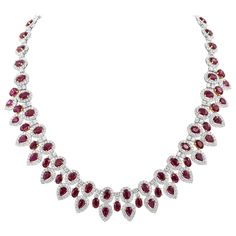 An elegant and well-crafted collar necklace, showcasing 38.92 carats oval cut and pear shape rubies certified by GIA as natural and of Burmese origin. Each ruby is set in an 18K yellow gold floating design and accented with a halo of round brilliant cut diamonds weighing 14.30 carats total. Finely made with 18K white gold.  Roman Malakov is a custom house, specializing in creating anything you can imagine. If you would like to receive a special quote on a custom piece, please message or call us. Ruby Diamond Necklace, Ruby Jewelry Necklaces, Rose Gold Diamond Necklace, Sapphire Diamond Necklace, Ruby And Diamond Necklace, Burmese Ruby, Diamond Pendants Designs, Diamond Tiara, Halo Necklace