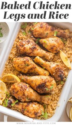 baked chicken legs and rice in a white casserole dish with lemon wedges